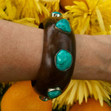 Wide wood bangle with large turquoise stones