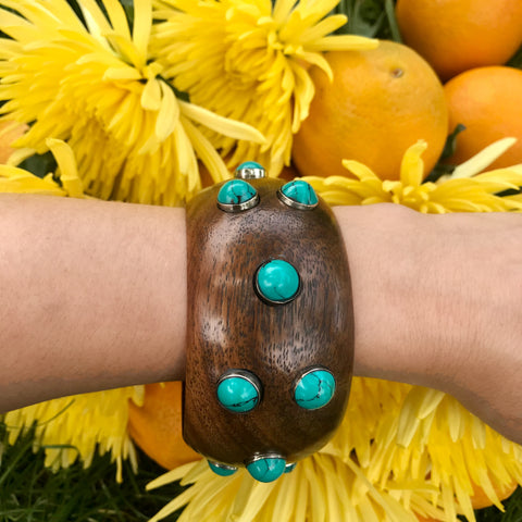 Wide wood bangle with round turquoise stones