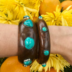 Wide wood bangle with large turquoise stones