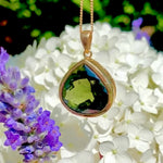 Moldavite pendant in 22k yellow gold