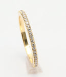 Diamond eternity band in yellow gold